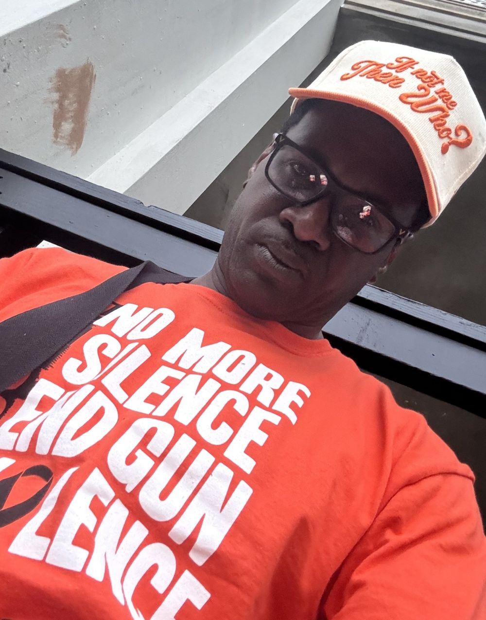 Cream and orange If Not Me Then Who hat worn outdoors