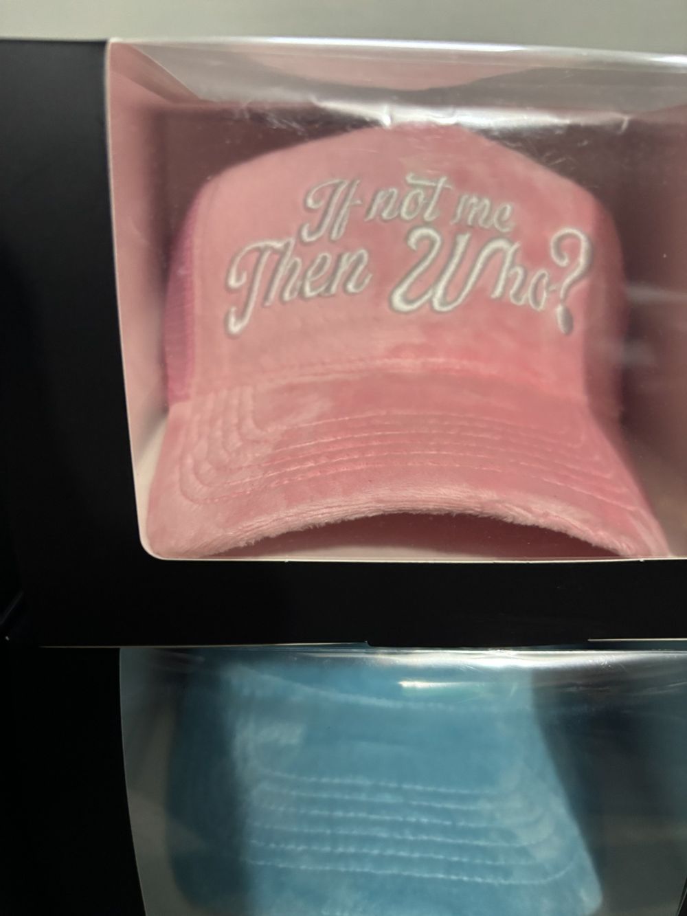 Pink and baby blue plush If Not Me Then Who truckers in packaging